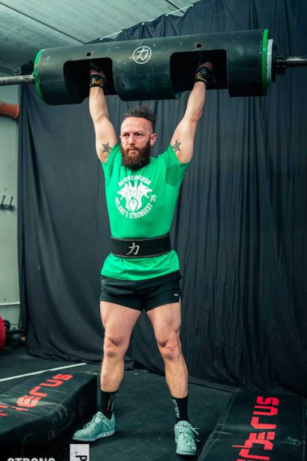 Claudio performing strongman training
